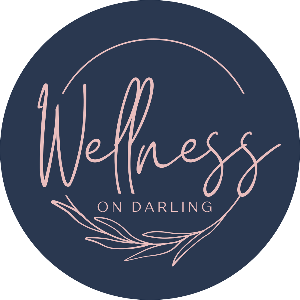 Wellness on Darling logo featuring elegant script and botanical elements, representing a wellness center in Balmain focused on massage and recovery services.