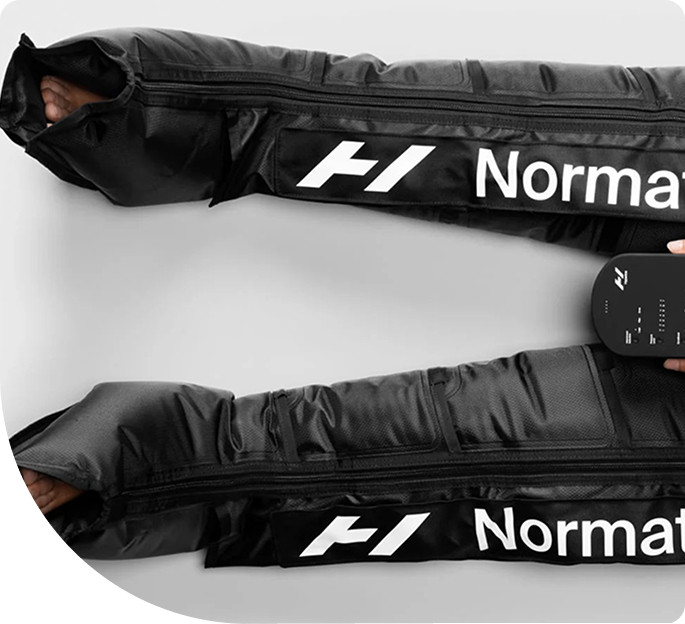 Normatec compression boots with control unit, designed for muscle recovery and improved circulation at Wellness on Darling.