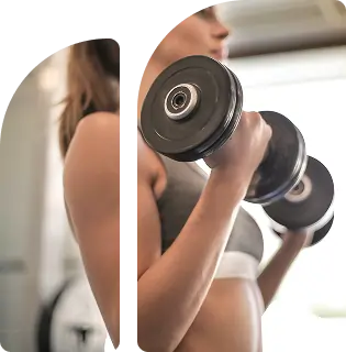 Woman exercising with dumbbells in a fitness environment, highlighting strength training and wellness journey.