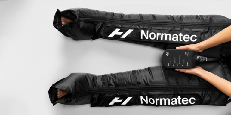 Normatec compression therapy equipment with control panel, designed for muscle recovery and enhanced mobility.